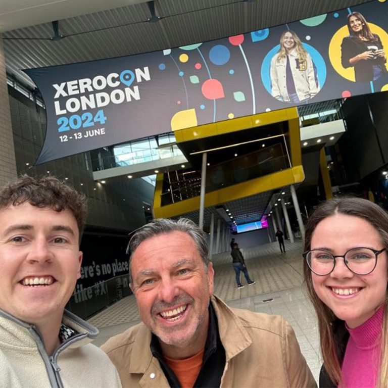 The Joiin team outside the Excel Centre with a Xerocon London banner in the background